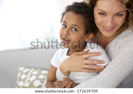Mother and son embracing each other