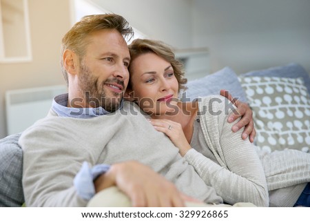 https://thumb7.shutterstock.com/display_pic_with_logo/624661/329926865/stock-photo-mature-couple-relaxing-in-couch-at-home-329926865.jpg