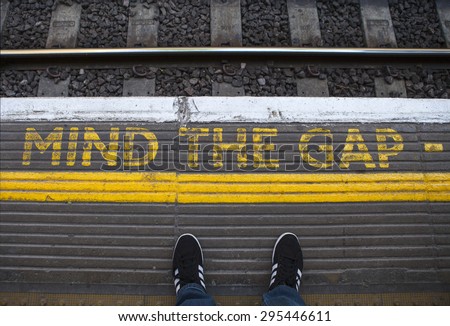 LONDON, UK - JULY 10TH 2015: Mind the Gap painted on a tube platform in central London, on 10th July 2015.