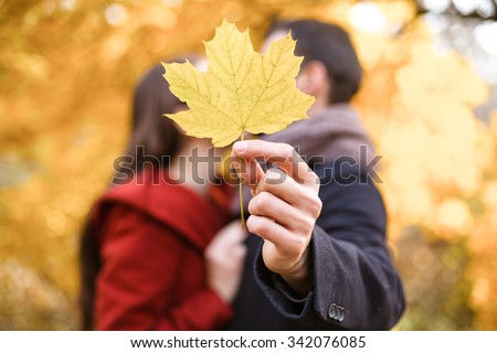 https://thumb7.shutterstock.com/display_pic_with_logo/634813/342076085/stock-photo-romantic-photo-of-cute-couple-outdoors-in-fall-young-man-and-woman-kissing-and-hiding-behind-maple-342076085.jpg
