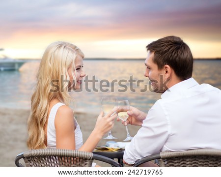 http://thumb7.shutterstock.com/display_pic_with_logo/64260/242719765/stock-photo-summer-holidays-people-romance-travel-and-dating-concept-couple-drinking-wine-in-cafe-on-242719765.jpg