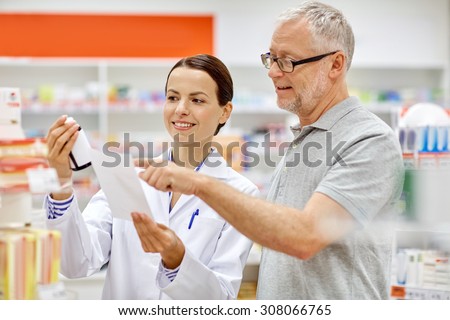 medicine, pharmaceutics, health care and people concept - happy pharmacist and senior man customer with drug and prescription at drugstore