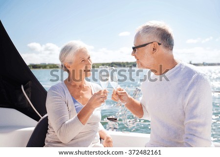 https://thumb7.shutterstock.com/display_pic_with_logo/64260/372482161/stock-photo-senior-couple-clinking-glasses-on-boat-or-yacht-372482161.jpg