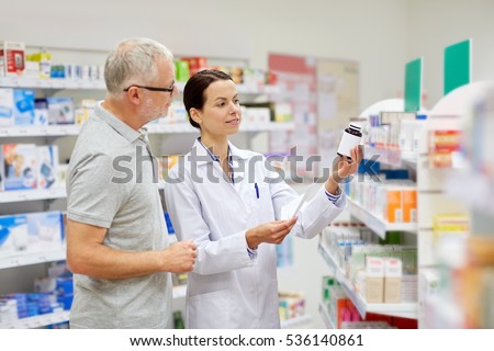 medicine, pharmaceutics, health care and people concept - happy pharmacist and senior man customer with drug and prescription at drugstore