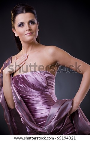 https://thumb7.shutterstock.com/display_pic_with_logo/65566/65566,1289887628,1/stock-photo-beautiful-young-woman-posing-wearing-a-light-purple-evening-dress-with-stole-65194021.jpg