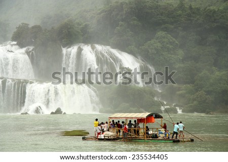 VIETNAM, CAO BANG, 15 AUGUST 2014 - Bamboo Raft with tourists near Ban Gioc or Detian waterfall at the border between Vietnam and China