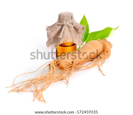 Ginseng root with pharmaceutical bottle and leawes. Isolated.