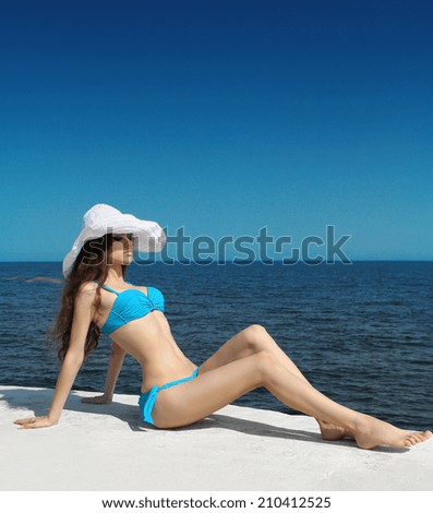 https://thumb7.shutterstock.com/display_pic_with_logo/662170/210412525/stock-photo-sunbathing-girl-enjoyment-slim-bikini-model-woman-in-bikini-over-blue-sky-lying-on-the-beach-210412525.jpg