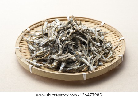 Dried sardine on bamboo basket