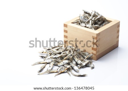 Dried sardine in the wooden square cup