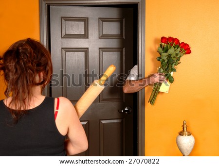 stock-photo-husband-coming-home-late-to-an-angry-wife-who-is-holding-a-rolling-pin-27070822.jpg