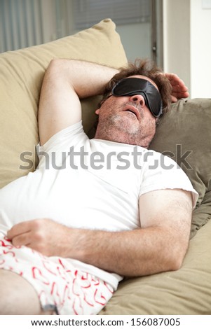 stock-photo-lazy-unemployed-man-asleep-o