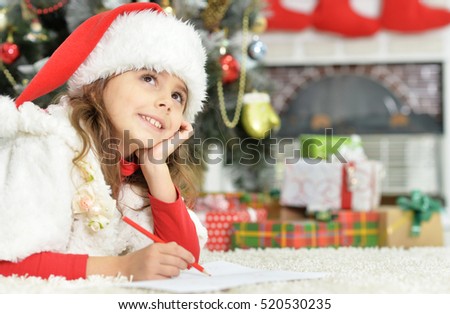 Little girl writing letter