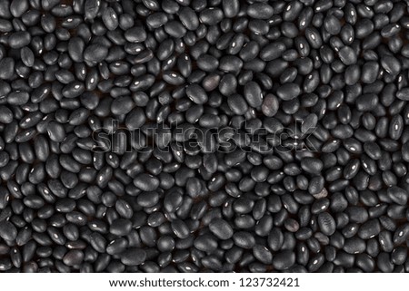 A close up image of heap black beans