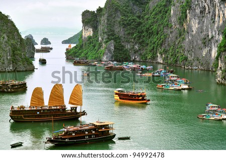 Tourist Junks and Floating village in Halong Bay, Vietnam.
