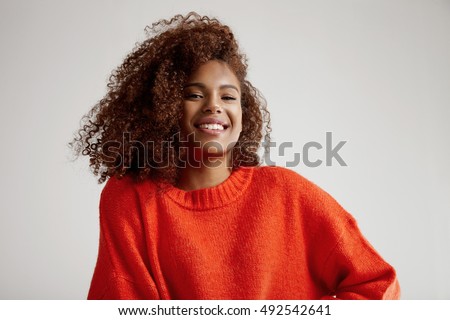 happy black woman with big curly afro hair