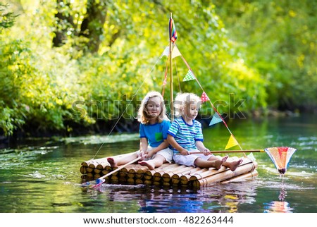 Two Children On Wood   en Raft Catching Stock Photo 482263444 