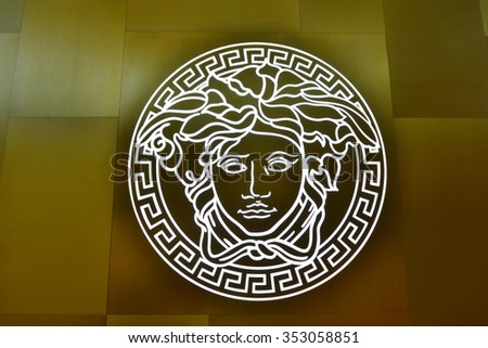 SINGAPORE - NOVEMBER 18, 2015: close us shot of Versace logo on the wall. Versace, is an Italian fashion company and trade name founded by Gianni Versace in 1978