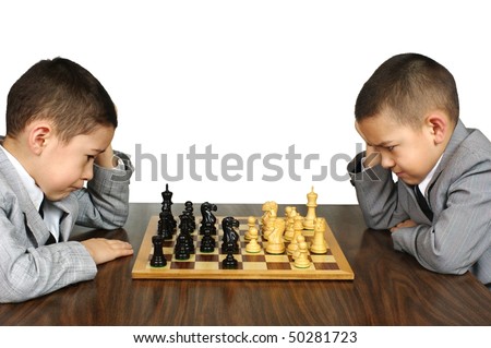 Kids playing chess, isolated on white