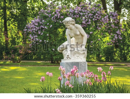 Man At Statue Of Naked Woman In Denantou Park Lausanne 