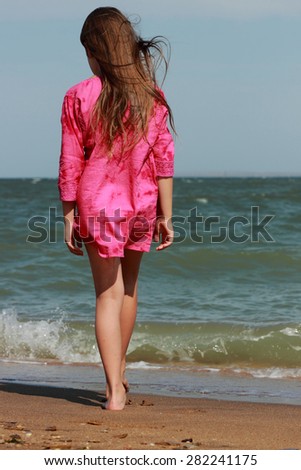 Little beautiful girl enjoy her life under the sun over sea beach, East ...