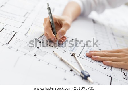 Architect working on blueprint