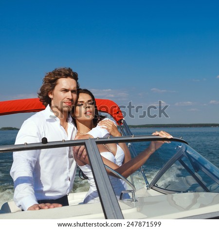 https://thumb7.shutterstock.com/display_pic_with_logo/719740/247871599/stock-photo-young-couple-loving-each-other-young-family-on-a-sea-voyage-on-a-yacht-247871599.jpg
