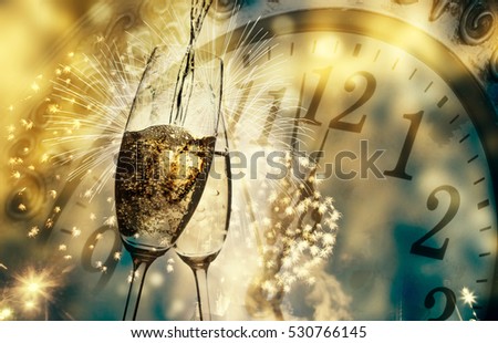 toasting with champagne glasses against holiday lights and clock close to midnight - New Year background