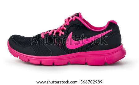 Chisinau, Moldova- May 27, 2015: Nike lady's - women's running shoes - sneakers - trainers, in gray and pink, showing the Nike swoosh logo and sole
