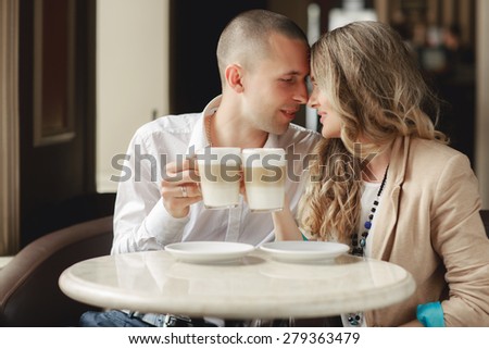 https://thumb7.shutterstock.com/display_pic_with_logo/745759/279363479/stock-photo-happy-man-and-woman-in-cafe-loving-couple-on-date-at-cafe-two-people-in-cafe-enjoying-the-time-279363479.jpg