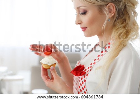 pretty young woman decorating cupcakes on her kitchen portrait of a beautiful female business owner - Woman Decorating Cupcakes pretty young woman decorating cupcakes on her kitchen portrait of a beautiful female business owner - Woman Decorating Cupcakes