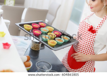 Woman Decorating Cupcakes beautiful cook showing stock images, royalty-free images & vectors Woman Decorating Cupcakes beautiful cook showing stock images, royalty-free images & vectors