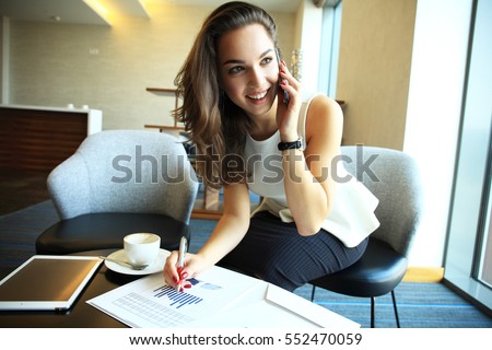 Business woman working in office with documents