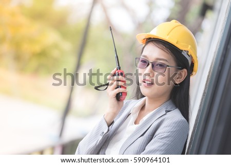 beautiful business asian woman use radio transmitting and receiving equipment