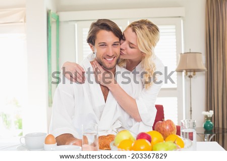 https://thumb7.shutterstock.com/display_pic_with_logo/76219/203367829/stock-photo-cute-couple-in-bathrobes-having-breakfast-together-at-home-in-the-living-room-203367829.jpg