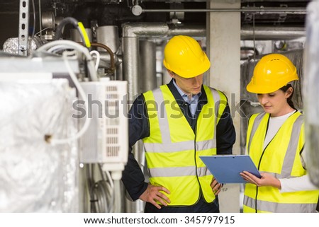 Engineer smiling at the camera in temperature control room