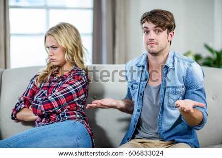 stock-photo-couple-having-an-argument-on-the-sofa-606833024.jpg