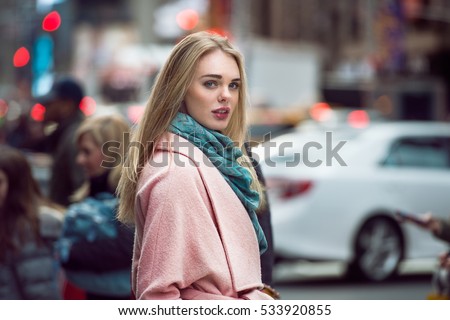 http://thumb7.shutterstock.com/display_pic_with_logo/772780/533920855/stock-photo-beautiful-elegant-woman-walking-on-the-crowd-on-new-york-city-street-wearing-pink-fashionable-533920855.jpg