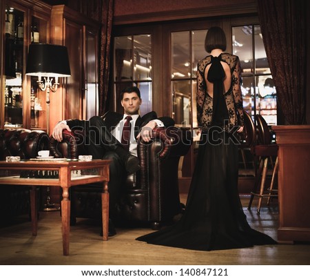 https://thumb7.shutterstock.com/display_pic_with_logo/78238/140847121/stock-photo-elegant-couple-in-formal-dress-in-luxury-cabinet-140847121.jpg