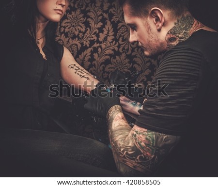 https://thumb7.shutterstock.com/display_pic_with_logo/78238/420858505/stock-photo-professional-tattoo-artist-makes-a-tattoo-on-a-young-girl-s-hand-420858505.jpg