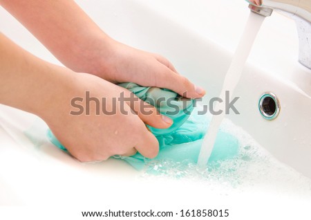 Hand Washing Clothes Stock Images, Royalty-Free Images &amp; Vectors