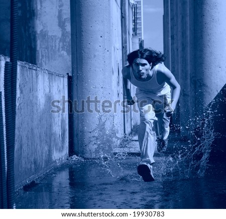 young man with long hair running on water
