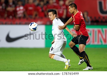 NONTHABURI-THAILAND FEB 8: Nguyen Van Quyet #10 (white)of Hanoi T&T in action during the AFC Champions League 2014 between Muangthong utd and Hanoi T&T at SCG Stadium on February 8, 2014 in Thailand.