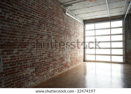 Loft Apartment Brick Stock Images, Royalty-Free Images & Vectors ...  Modern studio loft with garage door