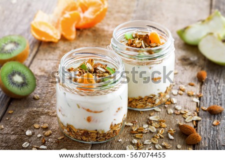 Healthy meal made of granola, yogurt and fruits. Delicious food for breakfast. Traditional American snack.