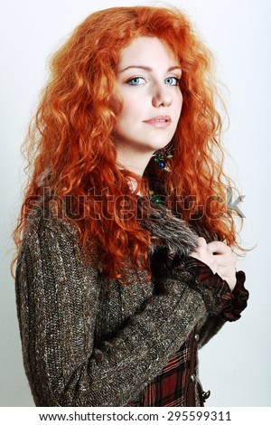 stock photo portrait of a beautiful woman with red curly hair in knitted winter clothes 295599311