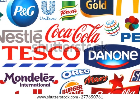 KIEV, UKRAINE - MAY 07, 2015:Collection of popular food logos companies printed on paper:Coca-Cola, Pepsico, Nestle, Tesco and others.