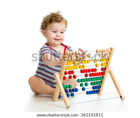 Baby playing with abacus toy. Concept of early learning child