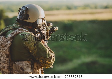 Infantry soldier shooting during military combat training.war, army, weapon, technology and people concept.