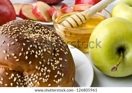 Still life closeup - challah, apples and bowl of honey closeup. Illustration of Rosh Hashanah (jewish new year) or Savior of the Apple Feast Day